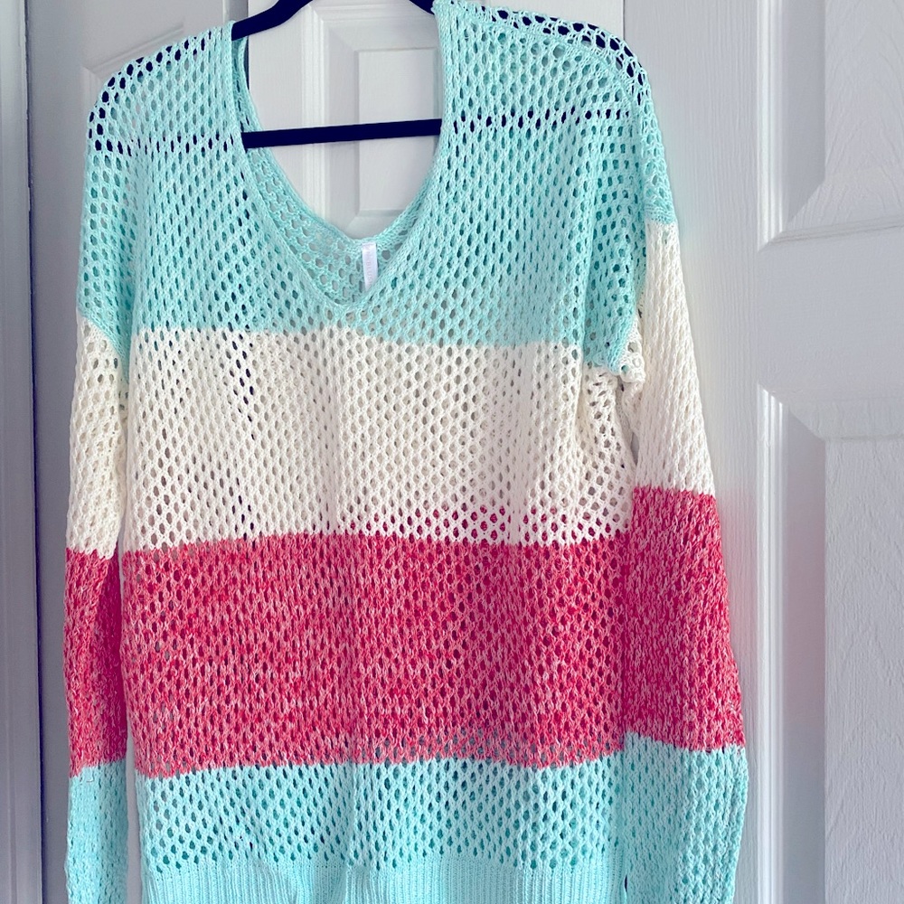 Pretty mesh type sweater. Long sleeve. V neck front and back. Hardly ever worn.
